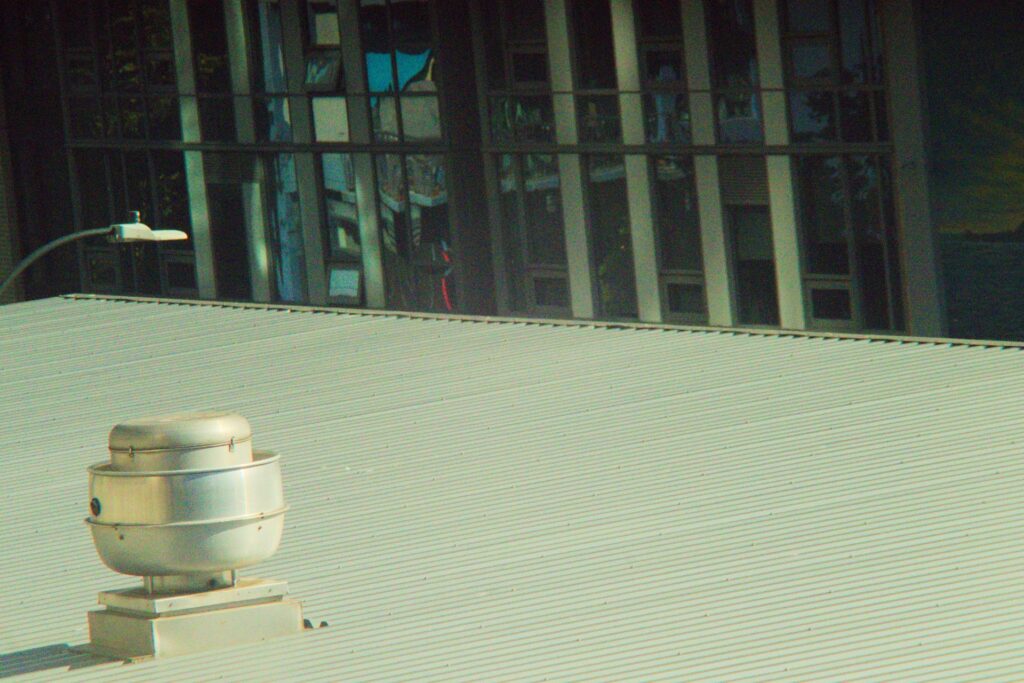 Vent on a coated commercial metal roof