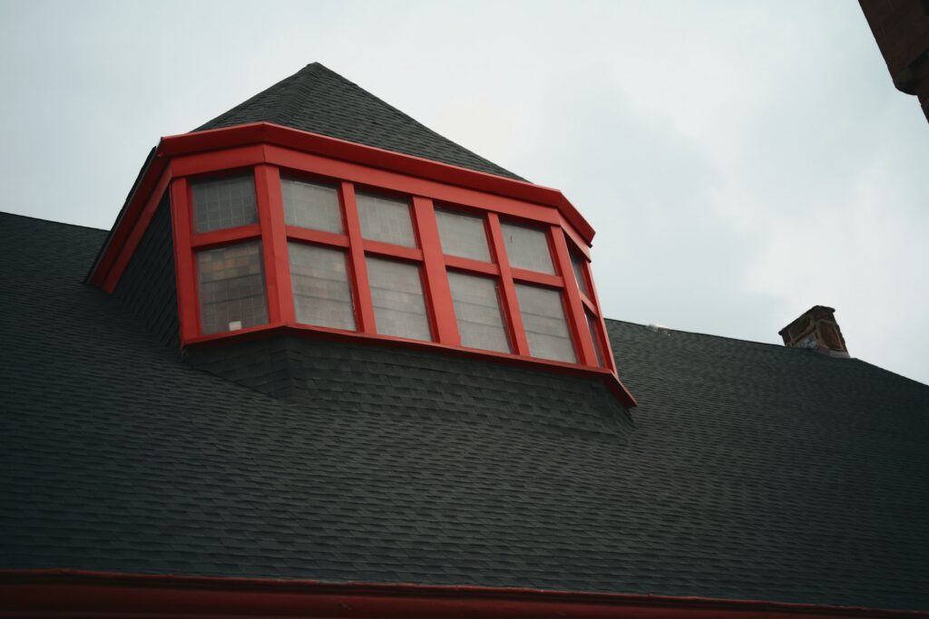 Dark architectural shingle roof with dormer