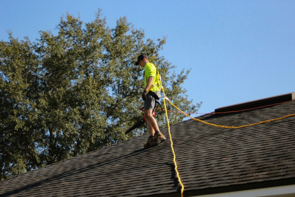 Roofer inspecting a residential roof